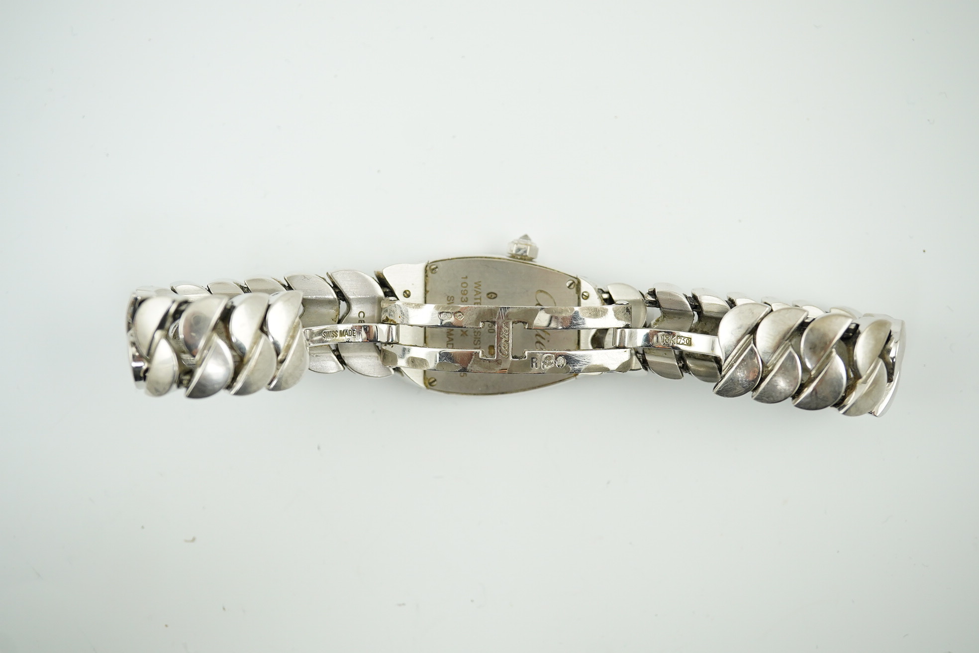 A lady's recent 18ct white gold and diamond set Cartier La Dona quartz wrist watch, on an 18ct white gold Cartier bracelet